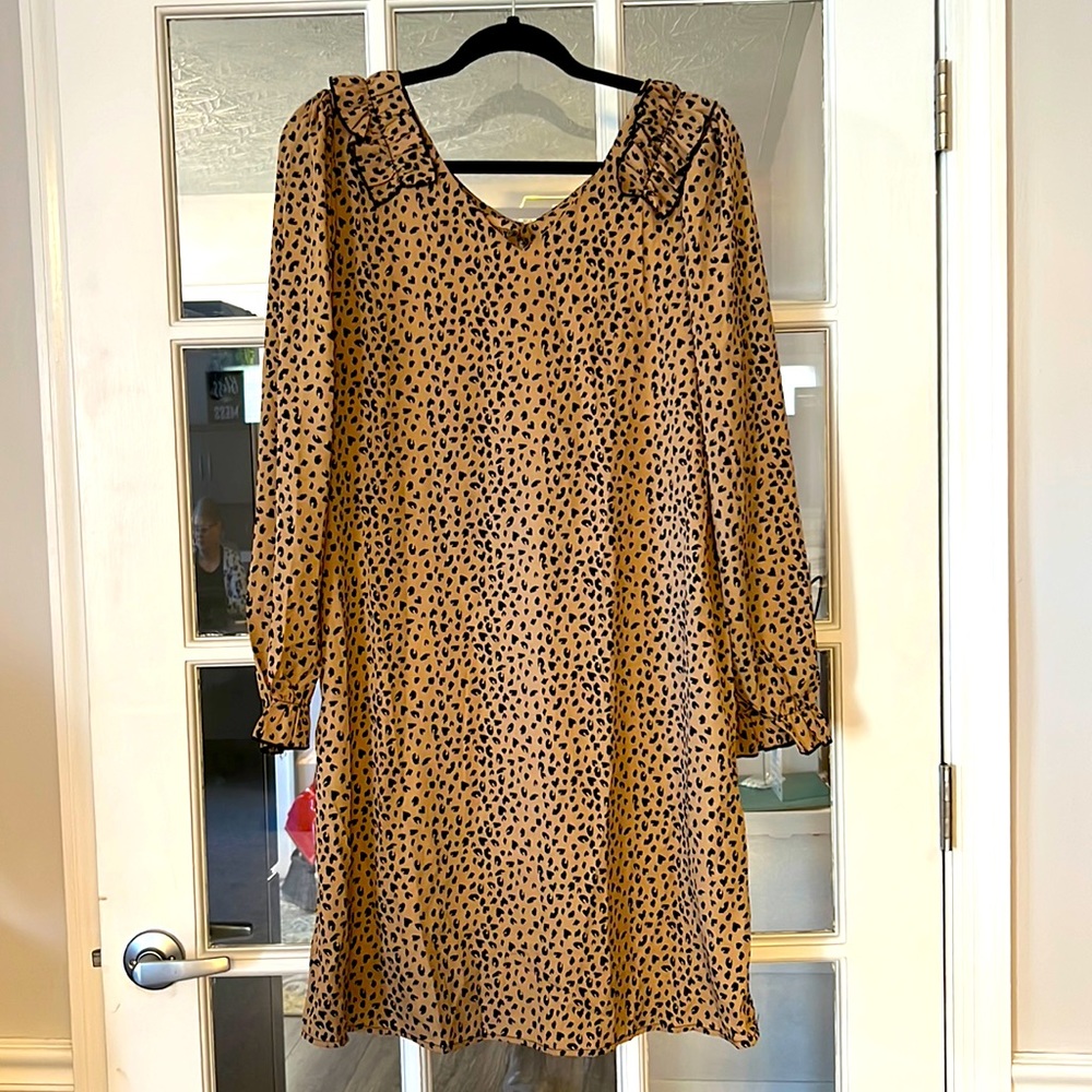 beige and faux cheetah print dress. Ruffle neckline with 3/4 sleeves. NEW